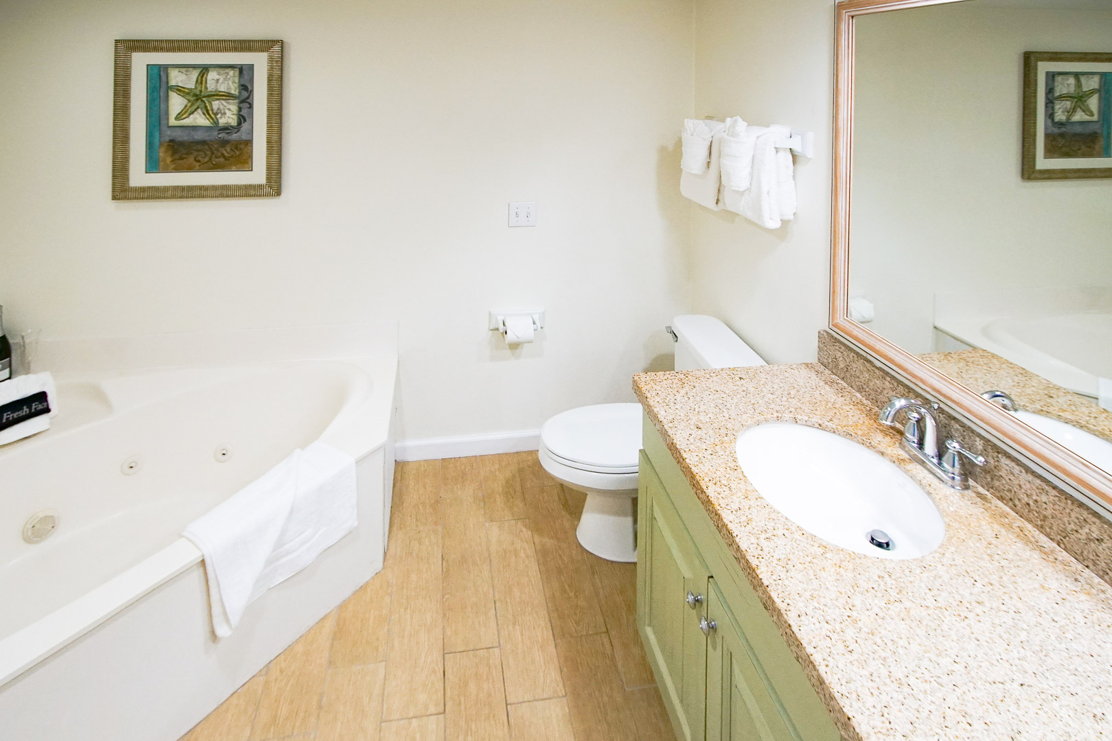An airy bathroom with jacuzzi tub at VRI's The Resort on Cocoa Beach in Florida.